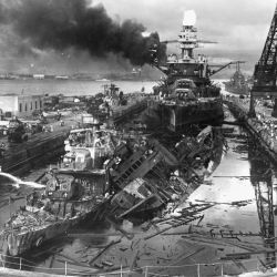 Naval photograph documenting the Japanese attack on Pearl Harbor, Hawaii which initiated US participation in World War II. Navy