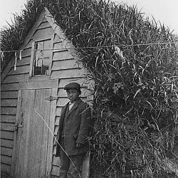 St. Paul Island, Alaska. Native barabara and Aleut boy. (Alaska Investigations-1914)