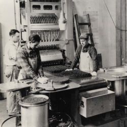Employees Working with the Automatic 16 Inch Powder Stacking Machine