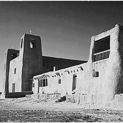 Corner view showing mostly left wall, "Church, Acoma Pueblo [National Historic Landmark, New Mexico]." [Misicn de San Estevan del Rey, Acoma]
