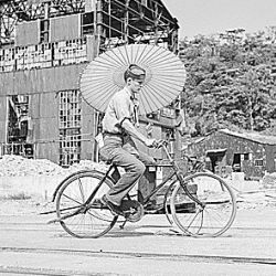 Seaman Paul Gray of San Dimos, Calif., rides Japanese bicycle in Tokyo, Japan