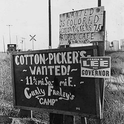 On Highway 84, outskirts of Eloy, Pinal County, Arizona. Highway signs reading "cotton pickers wanted"...
