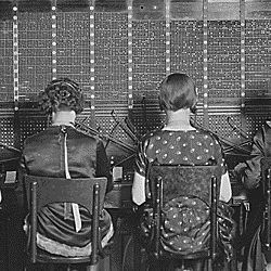 Chesapeake and Potomac Telephone Company. View of row of operators. View of chairs showing type of chairs used by telephone company