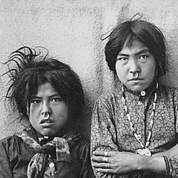 Two Tlingit girls, Tsacotna and Natsanitna, wearing noserings, near Cooper River, Alaska