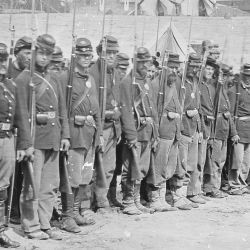 Company of Infantry on parade. Part of 6th Maine Infantry after battle of Fredericksburg. At time of the charge across stone wall at foot of Marye Heights Gen. Hooker in command of Federals, Gen. Fitz
