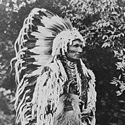 Umapine (Wakonkonwelasonmi), a Cayuse chief; full-length, standing, wearing a feathered head-dress