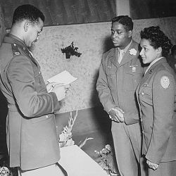 "Chaplain William T. Green reads the benediction at the marriage ceremony of Pfc. Florence A. Collins, a WAC of the 6888th Postal Directory Battalion, to Cpl. William A. Johnson of the 1696th Labor Su