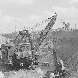 Travelling dipper shovel in operation at this strip coal mine. Ayrshire Colliers Company, Chinook Mine, Stauton, Clay County, Indiana