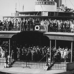 The ferryboat Dongan Hills, filled with commuters, about to dock at a New York City pier