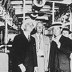 City officials inspecting a subway car newly equipped with ventilating devices that operate while the car