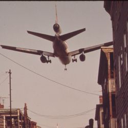 Near Logan Airport--Airplane Coming In For A Landing Over Neptune Road Homes
