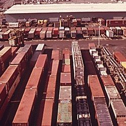 SHIPPING CONTAINERS COVER THE DOCKS AT THE PORT OF NEWARK NEW JERSEY, READY FOR LOADING ONTO SHIPS AND TRANSPORT TO VARIOUS DESTINATIONS