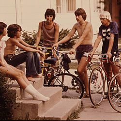 Youths Congregate Around The Front Steps Of A Home In New Ulm, Minnesota, To Decide What To Do On A Summer Day...