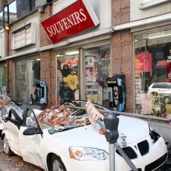 [Hurricane Katrina] New Orleans, LA, October 9, 2005 - This souvenir shop is open for business in New Orleans despite the sidewalk being blocked by crushed vehicles and debris leftover from Hurricanes