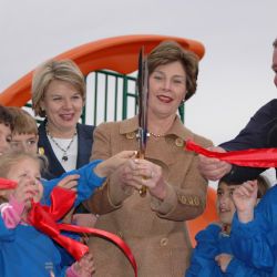 [Hurricane Katrina] Hancock County, MS, January 26,2005 -- First Lady Laura Bush gets help from students of Hancock North Central Elementary School and volunteers who built a new playground for studen