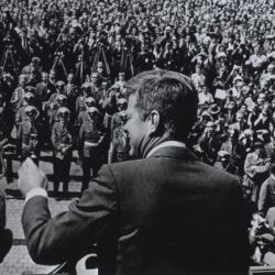 President Kennedy Waves A Greeting as He Begins His Speech in Bonn to a Crowd Which Flows into Buildings on the City Hall Square and on into Adjacent Side Streets