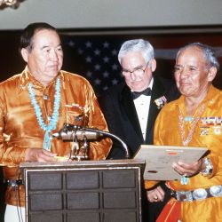 President of the Navajo Code Talkers, left, Joe Garza, Ceremony Chairman, center, and the Vice-President of the Code Talkers Present the Commandant of the Marine Corps GEN. Alfred M. Gray Jr. with a C