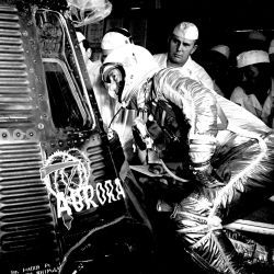 Astronaut Scott Carpenter Looking inside his Aurora 7 Spacecraft prior to Launch
