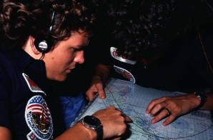 Astronauts Kathryn Sullivan and Sally Ride Look Over Orbit Map