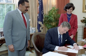 President Signing Hr 2230 Establishing a New Commission on Civil Rights with Linda Chavez and Clarence Pendleton in Oval Office