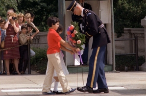Two children present a wreath at the Tomb of the Unknown Soldier in Arlington National Cemetery