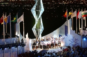 The 1980 U.S. Gold Medal Olympic Hockey Team Standing Below the Olympic Flame