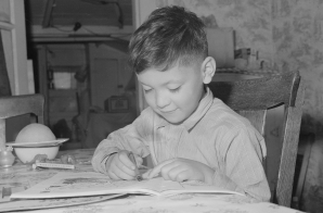 Child of Manuel Alcala, miner, coloring pattern in book.