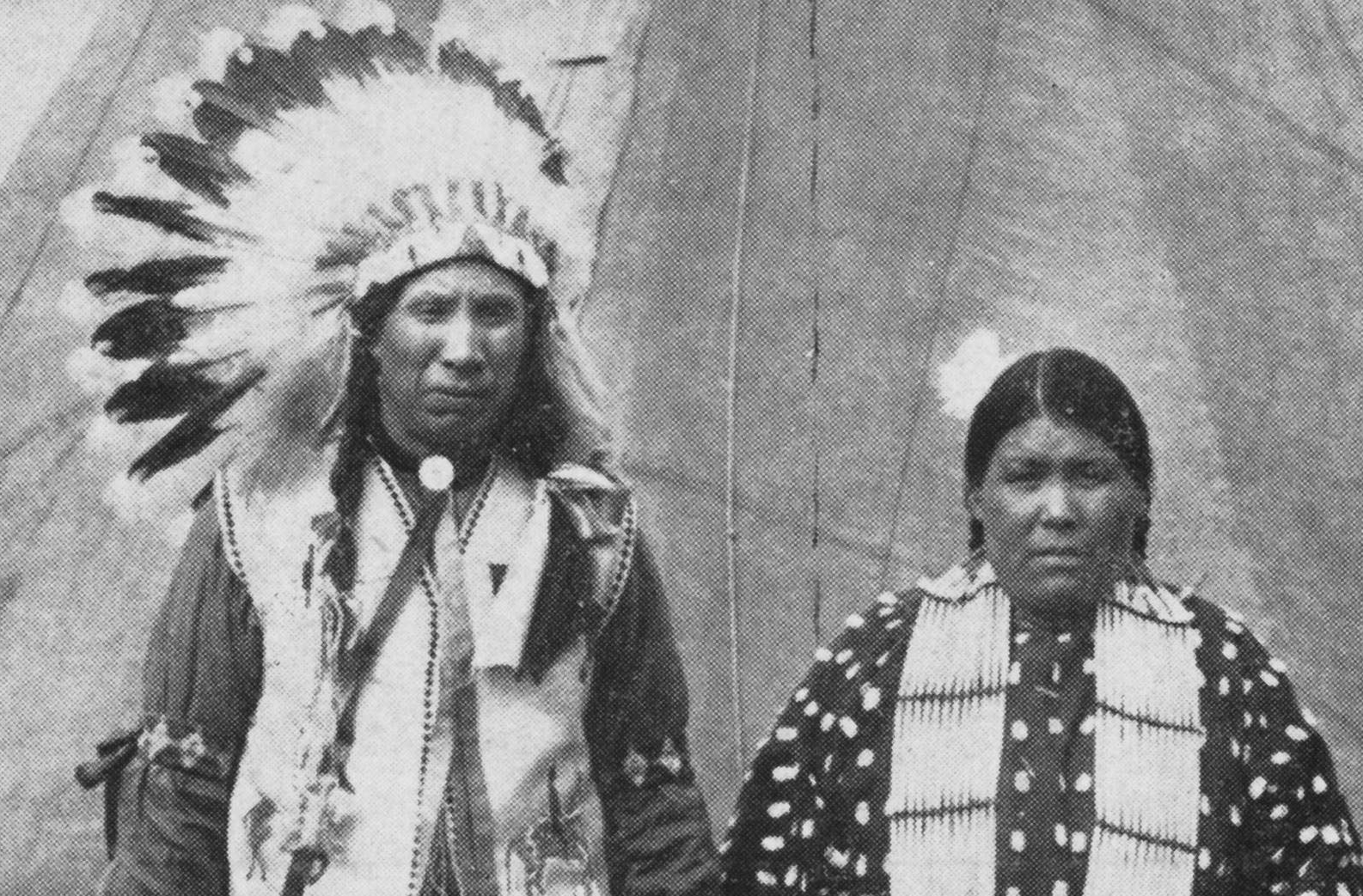 "Two Sioux Indians in Native Dress in Front of Teepee"