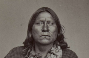 White Bear (Sa-tan-ta), a Kiowa chief; full-length, seated, holding bow and arrows