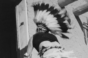 Dance, San Ildefonso Pueblo, New Mexico, 1942," two Indians in headdress ascending stairs to house