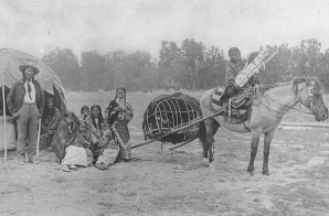 Cheyenne: Stump Horn and family showing Horse Travois