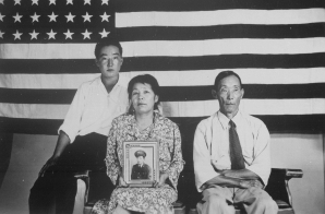 Hirano Family Posing with a Photograph of Their Son in Uniform