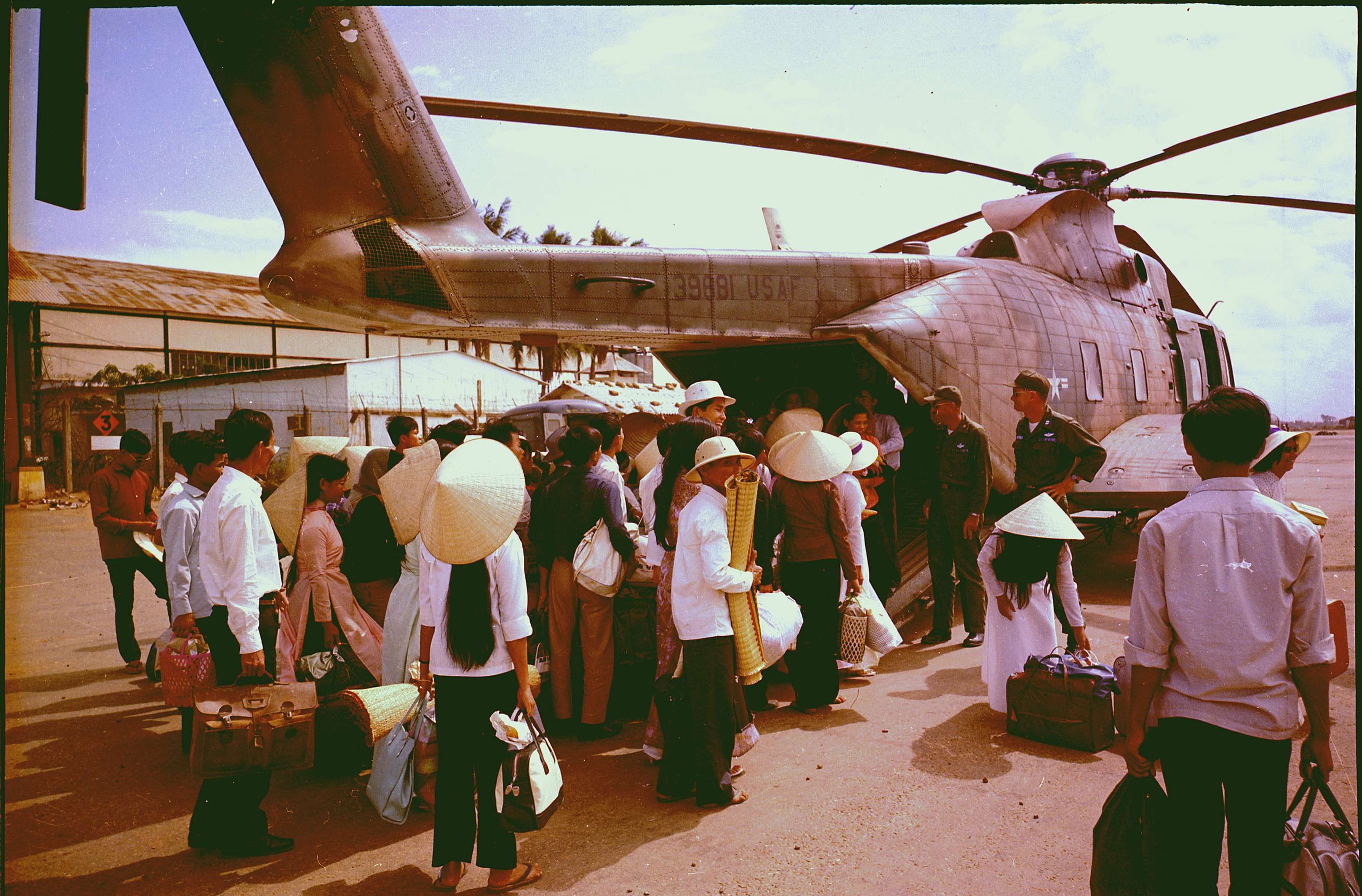 South Vietnamese Villagers Board Air Force CH-3C Helicopter For Evacuation
