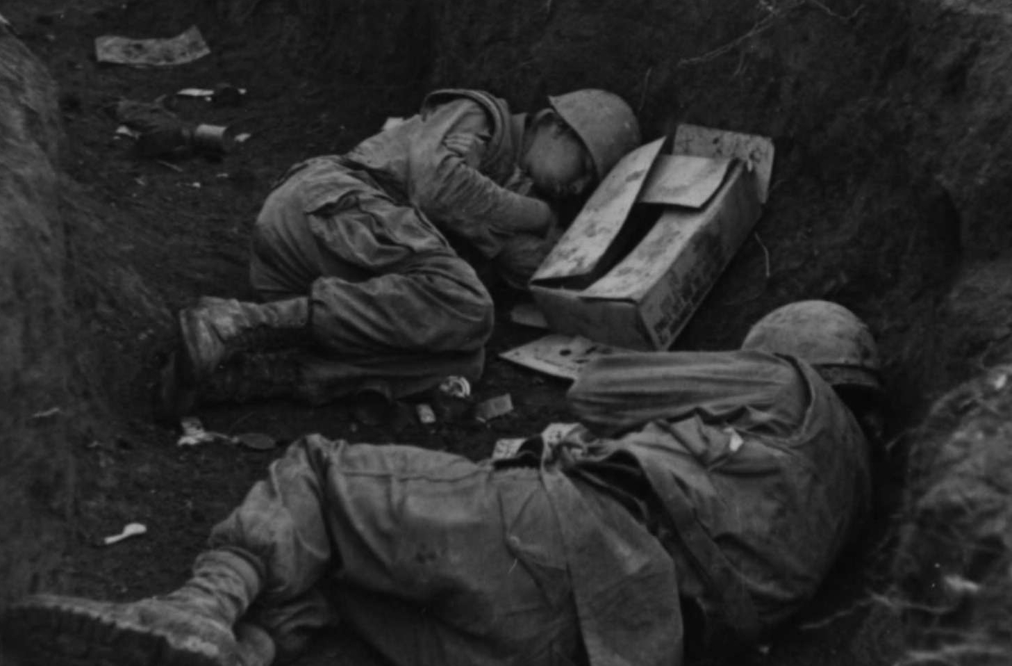 Two Marines Sleep in Trench Line